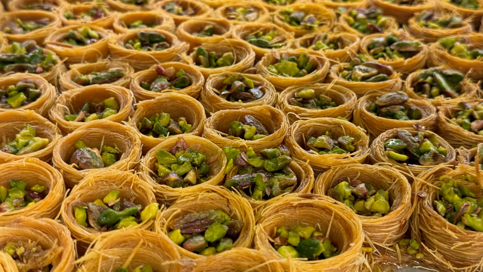 Delicious trays of traditional Kataifi pastry topped with pistachios. — kataify y más